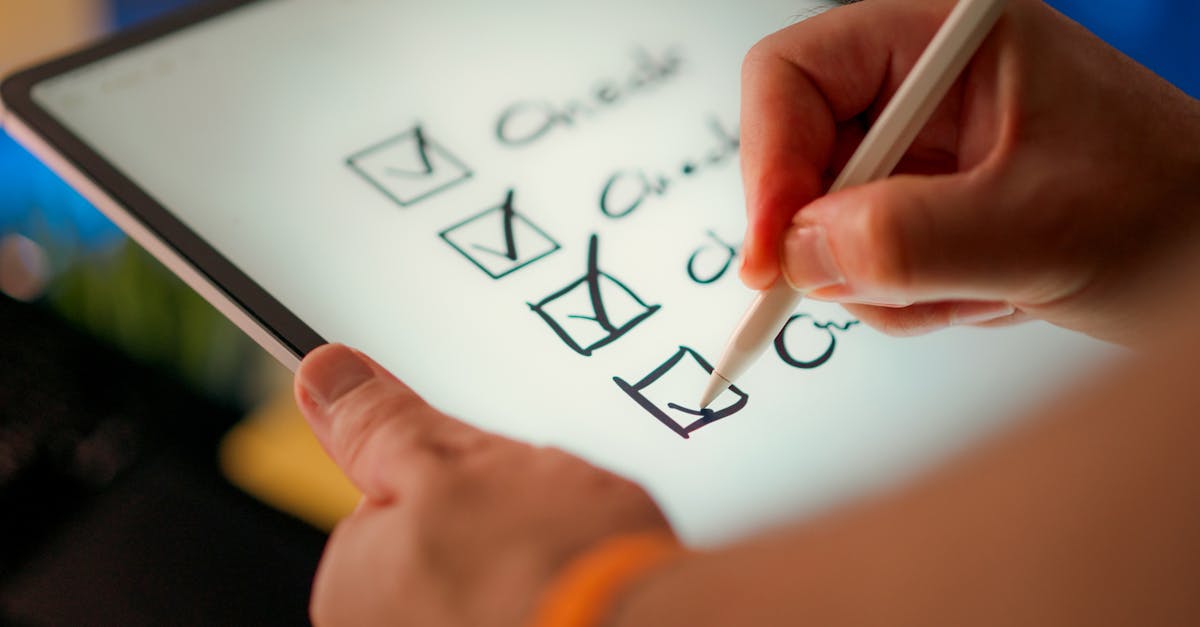 Close-up of a digital checklist being marked off on a tablet with a stylus pen.